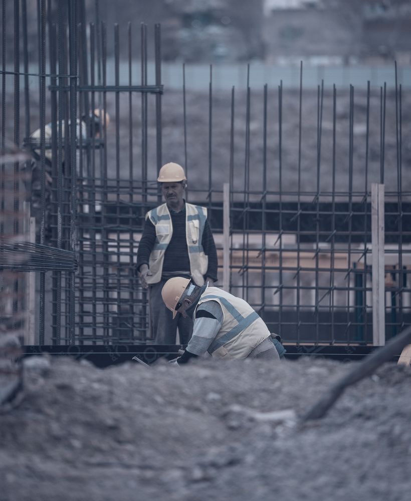 Supervisor checking a worker's task on site